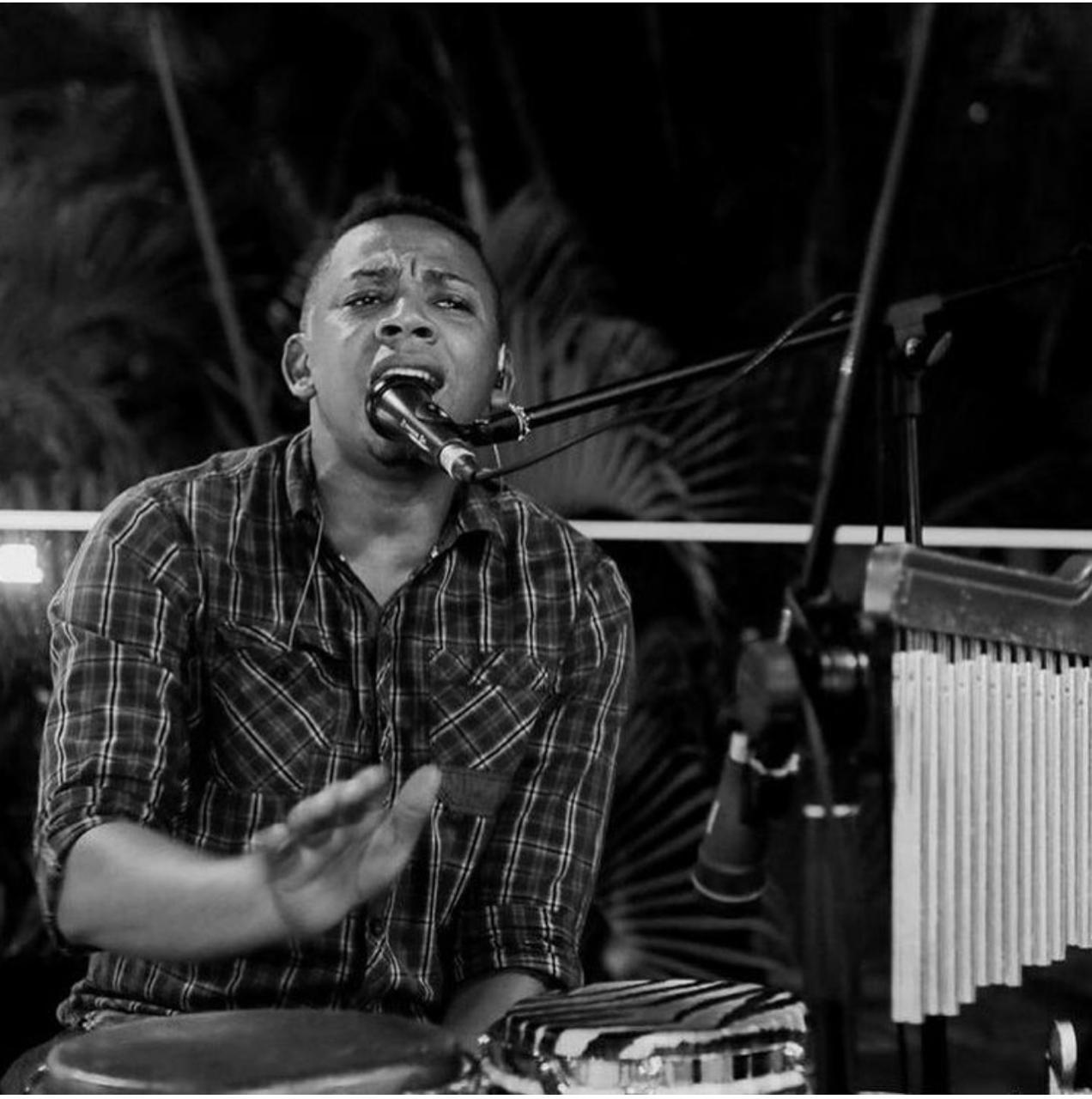 Musician playing the güira.